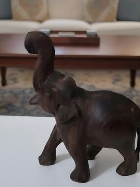 Vintage hand carved miniature Elephant figurine. Hand carved in a nice shape.